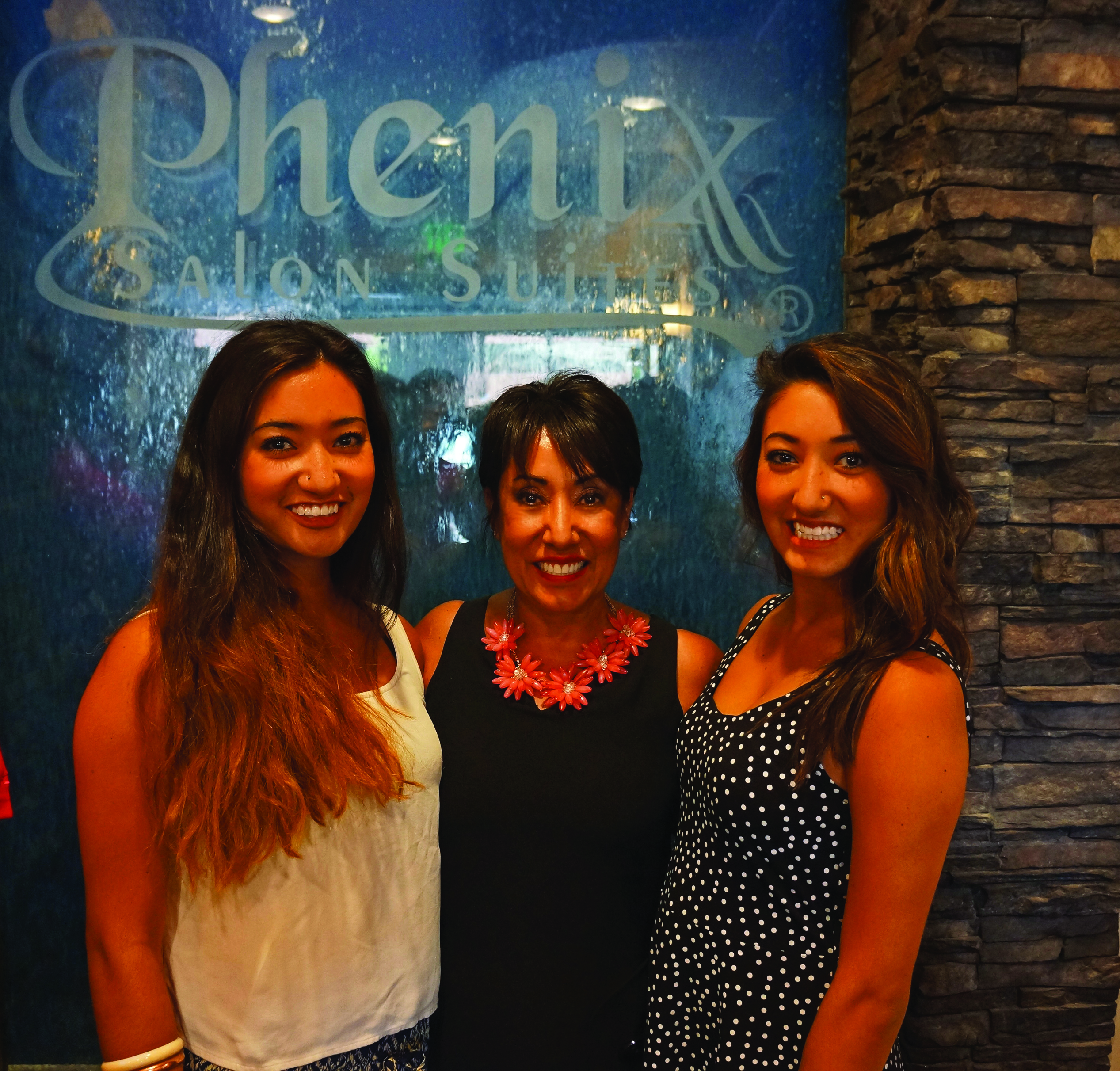 Managing Partner Deb DeYoung with twin daughters, Tommi, left, and Madison, right.